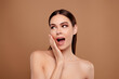 © Beauty Hero - Photo of adorable excited lady wear nothing arm cheek looking empty space isolated brown color background
