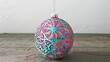 © Auon - Detailed glass ornament handcut designs and vibrant colors displayed on a minimalist background