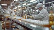© AlexCaelus - Workers in protective gear operate a factory assembly line, processing and packaging products for distribution in an industrial setting.