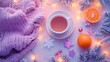 © Arifin Studio - A photo of a cozy table with hot tea, snowflakes, and tangerine on the top view, a knitted hat, garland lights, and Christmas decorations in pink and purple colors,