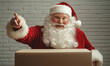 © PRASANNAPIX - Santa Claus opening the cardboard box