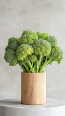 Wall Mural - Broccoli elegantly displayed on a podium, showcasing its vibrant green florets and detailed texture.