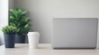 © CHOI POO - Minimalist Workspace with Laptop and Coffee Cup
