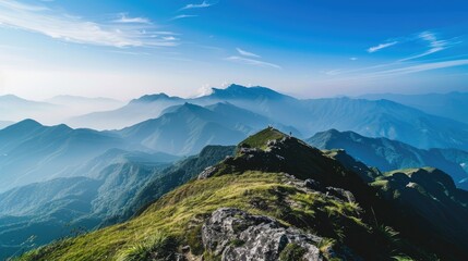 View from mountain peak under clear sky