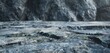 © creative_art86 - Closeup of a rocky surface with a dark gray color. The texture is rough and uneven, with a variety of shapes and sizes. The rocks are arranged in a haphazard fashion.