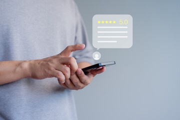 Fototapete - Person interacting with a smartphone, giving a five-star rating. Business service customer experience concept of customer feedback, reviews, and satisfaction in a digital setting.