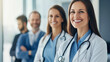 © Mirjana - A group of healthcare professionals smiling while providing compassionate care in a clinical setting during the day