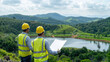 © Александр Марченко - Engineers inspecting plans for sustainable development project near lake