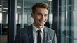 © Tengkwa - Confident Professional: A young, handsome businessman in a tailored suit smiles warmly, exuding confidence and success. He stands in a modern office setting.