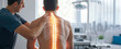 © Dina Photo Stories - Chiropractor examining patient with back pain in clinic. Physiotherapist working examining treating injured back of male patient with spine x-ray visualization, Rehabilitation therapy. spinal health
