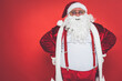 © oneinchpunch - Funny crazy santa claus having fun on a red colored background