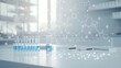 © Kenn W. - Modern laboratory scene with blue liquid in test tubes and digital molecular graphics, exemplifying scientific research and innovation.