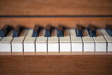 Close-up, keys of an antique wooden piano.