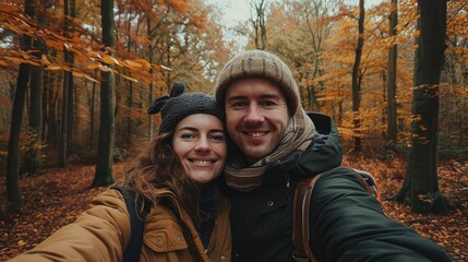 A happy sweet romantic couple travel on their honeymoon together in natural autumn forest.