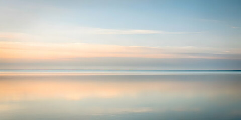 Sticker - Tranquil Horizon: A serene seascape at dawn, captured with a soft focus, evokes tranquility and a sense of peace. The gentle, pastel hues of the sky and water create a calming ambiance. 