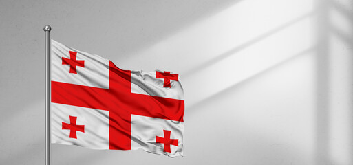 Wall Mural - Georgia national flag cloth fabric waving on beautiful window light grey Background.