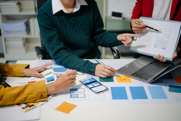 Wall Mural - ux developer and ui designer brainstorming about mobile app interface wireframe design with customer