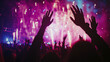 © @ArtUmbre - A vibrant nighttime scene at a concert or party. The foreground is dominated by the silhouettes of numerous hands raised in celebration, possibly indicating an audience enjoying the music