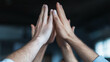 © Denis Yevtekhov - Team celebrating a business milestone with high-fives and smiles success, business, entrepreneurship, achievement, teamwork