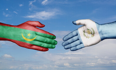 Guatemala and Mauritania country handshaking with flags, consensus concept international co-operation illustration