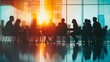 © sungedi - Silhouetted Business Meeting with Sunset in a Modern Office