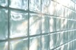 © Aliaksandra - glass brick wall illuminated by natural light, showcasing the transparency and beauty of architectural design in a concept banner