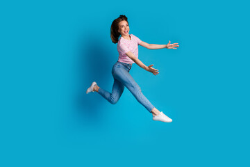 Poster - Photo of positive lovely cute woman wear trendy pink clothes hold object empty space isolated on blue color background