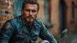 © Just1 - Brutal tattooed biker man in leather clothes and black motorcycle. High detail. Professional portrait shot