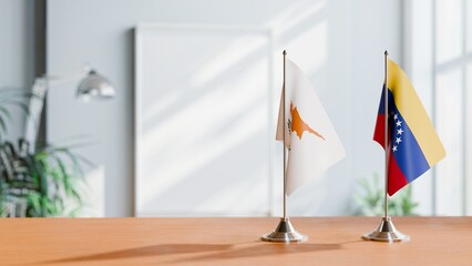 FLAGS OF CYPRUS AND VENEZUELA ON TABLE