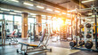 © Selene Studio - Blurred gym background with exercise equipment and weightlifting area, fitness, workout, gym, health, exercise, training