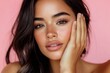 © MUdaylah - Stunning Latina woman with radiant skin and soft makeup gently touches her cheek in this close-up portrait against a pink background. with generative ai