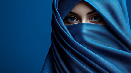 Canvas Print - A woman wearing a blue scarf with her eyes closed