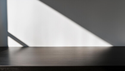 Wall Mural - Black wooden table with sunlight, making shadows on the surface and wall. Simple setting for product display