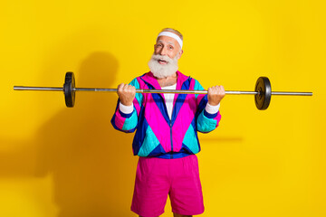 Canvas Print - Photo poster of handsome granddad sportsman lift barbell wear trendy vintage sportswear isolated on yellow color background