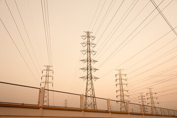 silhouette high voltage pole on sky sunset background.	