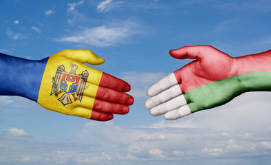 Madagascar and Moldova country handshaking with flags, consensus concept international co-operation illustration