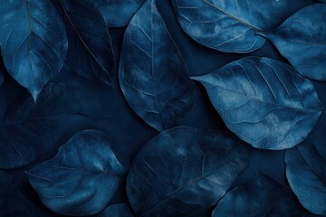 Wall Mural - A blue leafy background with a few leaves in the foreground