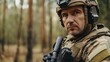 © Darcraft - A focused male soldier wearing tactical gear and a helmet in a forest, ready for a military mission or operation.