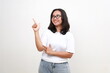 © ArvStd - Portrait of smiling young casual lady, asian woman pointing fingers left, showing client info, chart of banner aside on copy space, white background