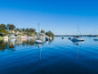 © Austockphoto - Recreational boats moored in water of Lake Macquarie in bright sunlight seen from aerial view