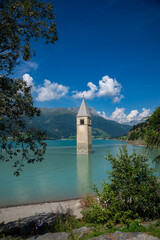 View of Lake Resia where you can admire the famous bell tower of