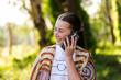 © Austockphoto - Aussie Teenager laughing on phone call holding mobile to ear