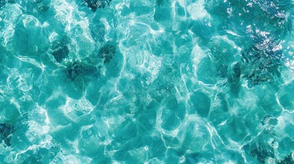 Crystal-clear turquoise water rippling gently under the sunlight, creating a serene and inviting atmosphere.