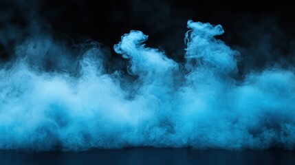 A mesmerizing display of blue smoke swirls gracefully against a dark backdrop, creating an ethereal atmosphere.