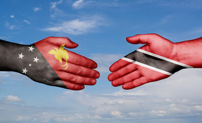 Trinidad and Tobago and Papua New Guinea country handshaking with flags, consensus concept international co-operation illustration