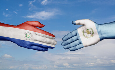 Guatemala and Paraguay country handshaking with flags, consensus concept international co-operation illustration