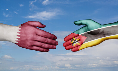 Wall Mural - Mozambique and Qatar country handshaking with flags, consensus concept international co-operation illustration