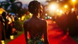 © Thavesak - Elegance on the Red Carpet: Ugandan Celebrity in High-Fashion Dress Under Glamorous Lighting