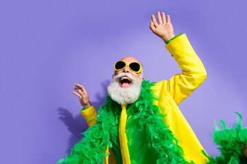 Sticker - Portrait of funny extravagant aged man clubbing dancing yellow suit isolated on purple color background