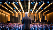 © niknet - a professional speaker, manager, giving a presentation to a seated audience.